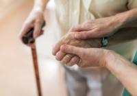 Elderly holding hands